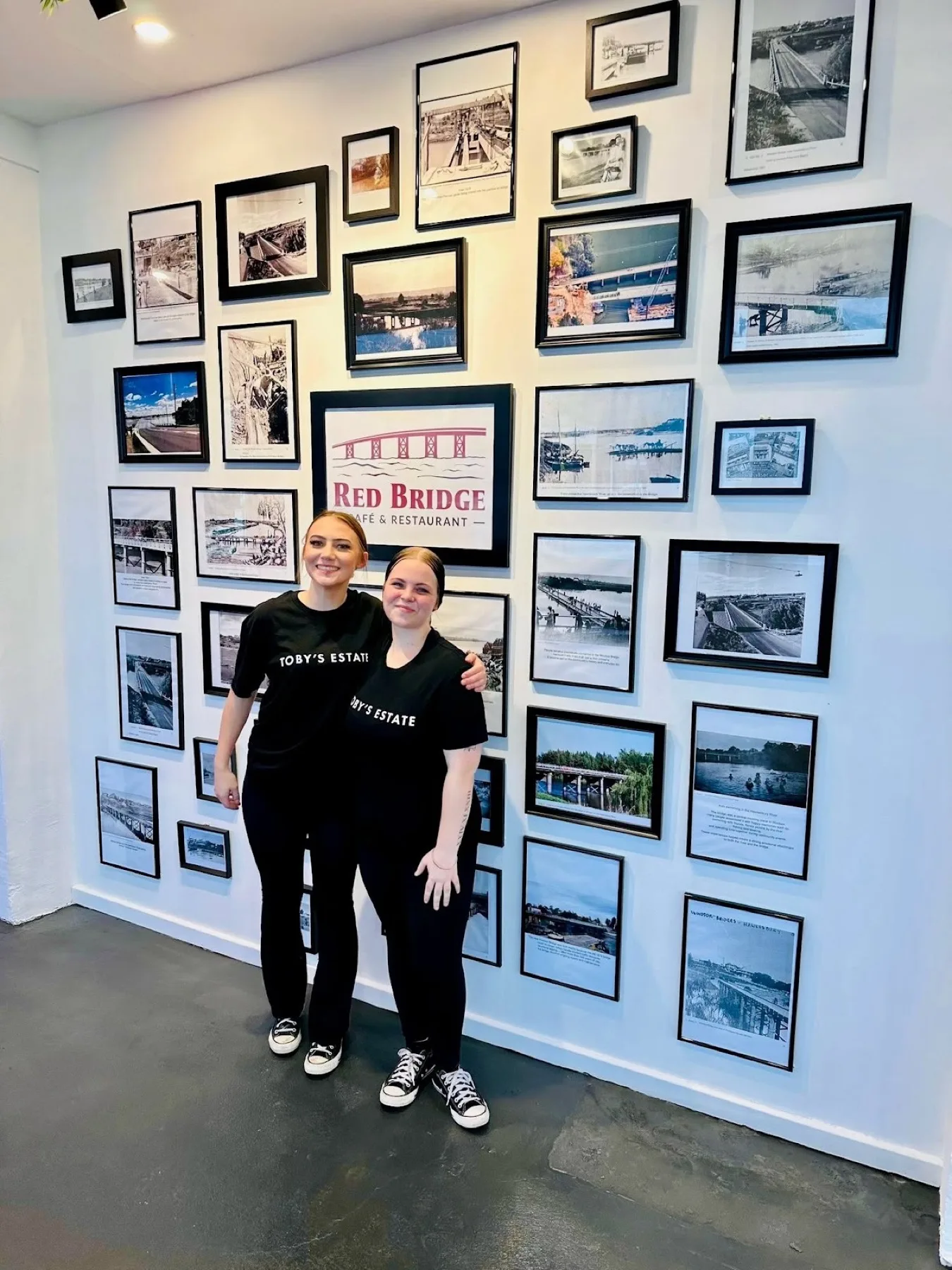 Team members by the wall of old Windsor photographs